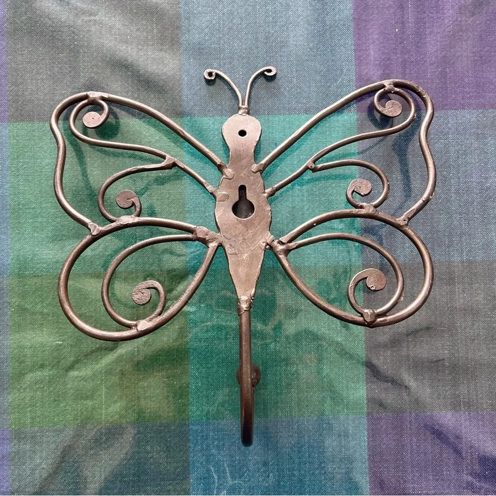 Cute metal butterfly wall art and hanger.
